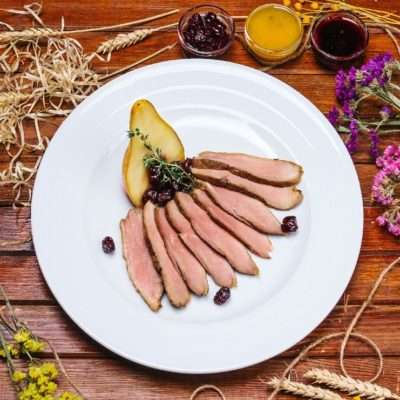 Duck with pear and cherry flambe