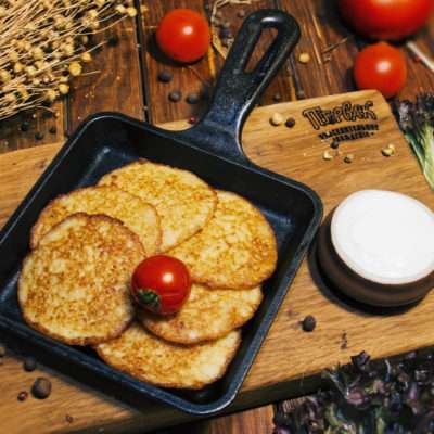 Traditional potato pancakes with sour cream